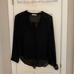 Sheer black shell with lace detail